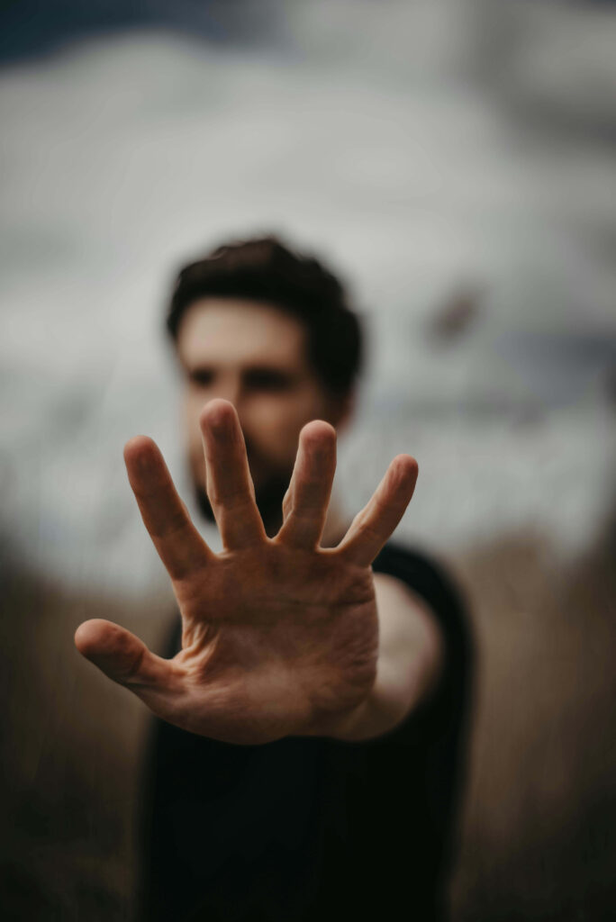 Man reaching out with outstretched hand.